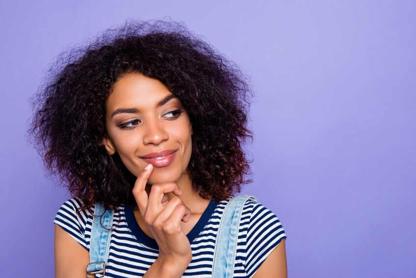 A beautiful black woman thinking about dating sites by ethnicity