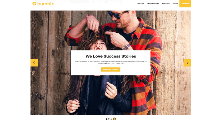 Bumble landing page screen. Guy single playing with a girls hair. She is laughing.