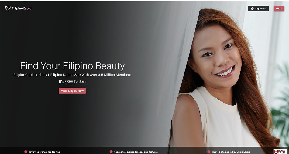 Pretty filipina leaning into curtain looking at camera smiling