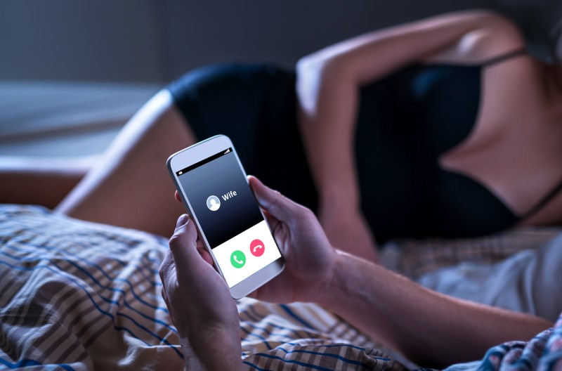 Cheating husband gets call from his wife while he's still in bed with affair