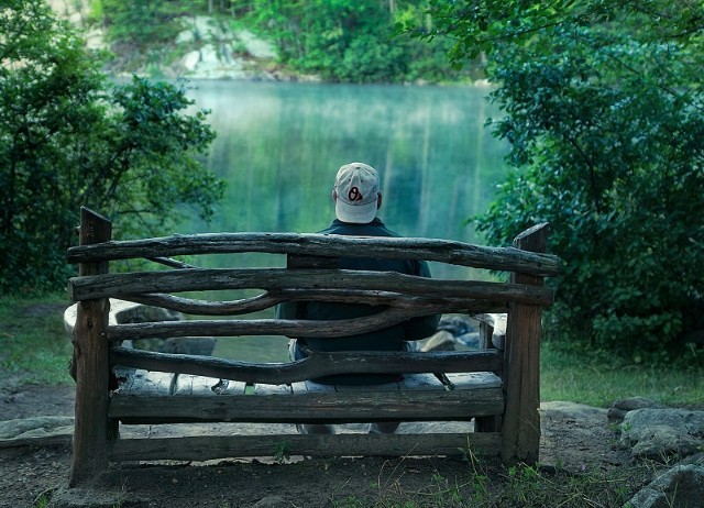 Single man on a bench waiting