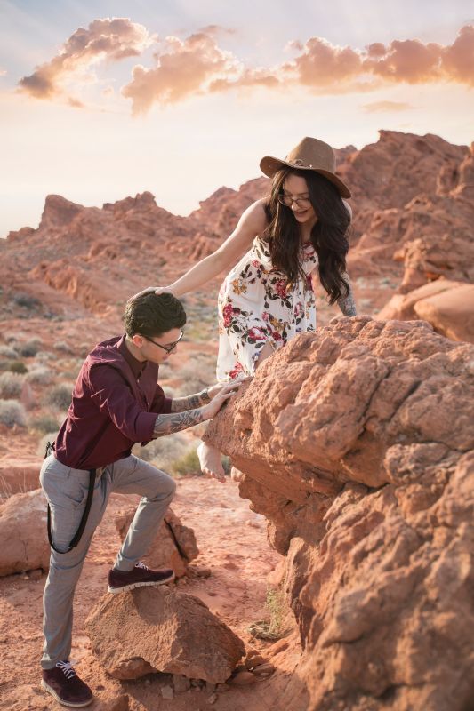 Woman and man climbing rocks together