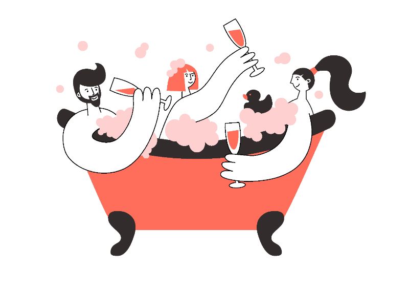 Two women and one man sitting in a bathtub together